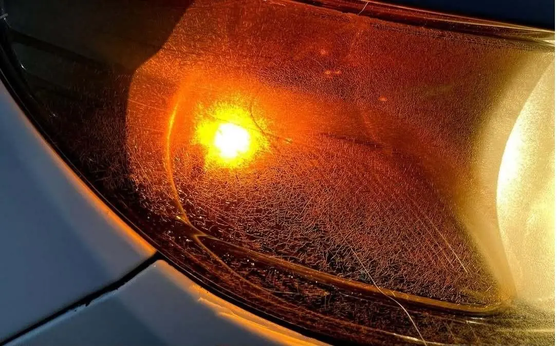 Amber headlight lens restoration — before