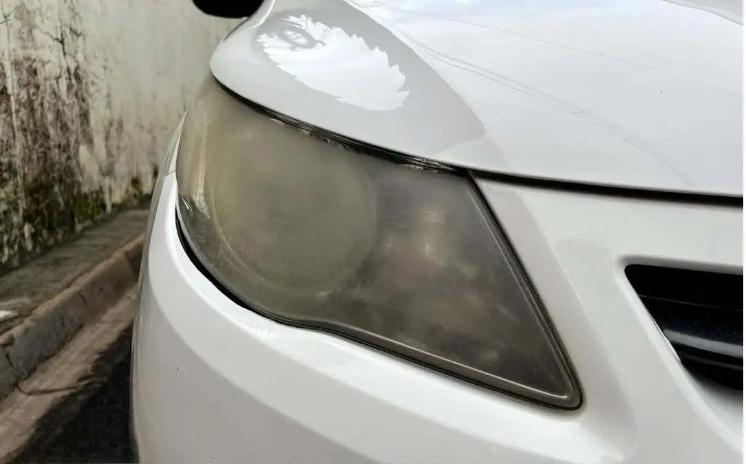 White car headlight restoration — before